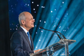 University of Toronto President Meric Gertler announces the Defy Gravity campaign’s major milestones standing at a podium